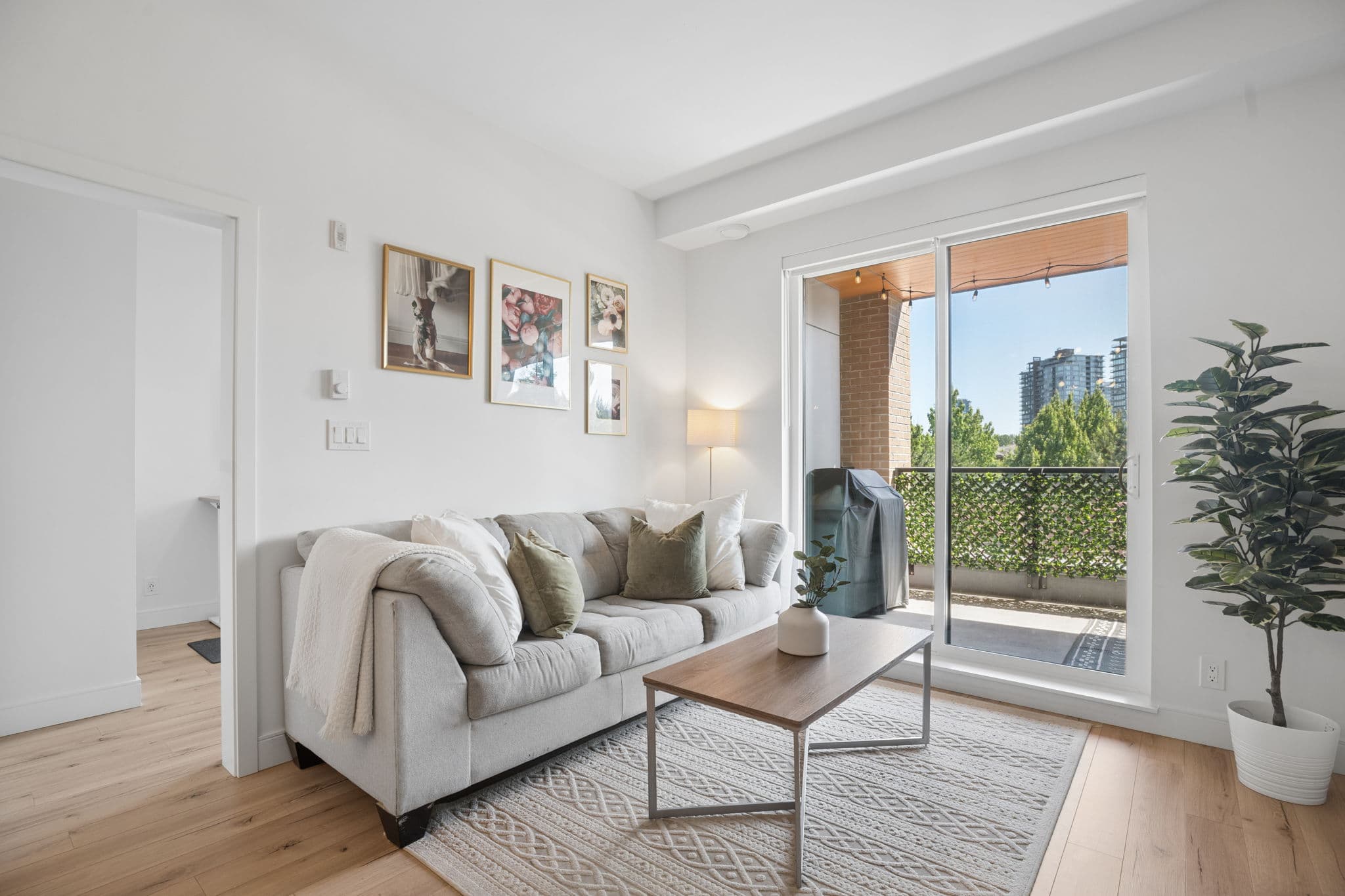 Living room with large window at 326-55 Klahanie Drive, Port Moody