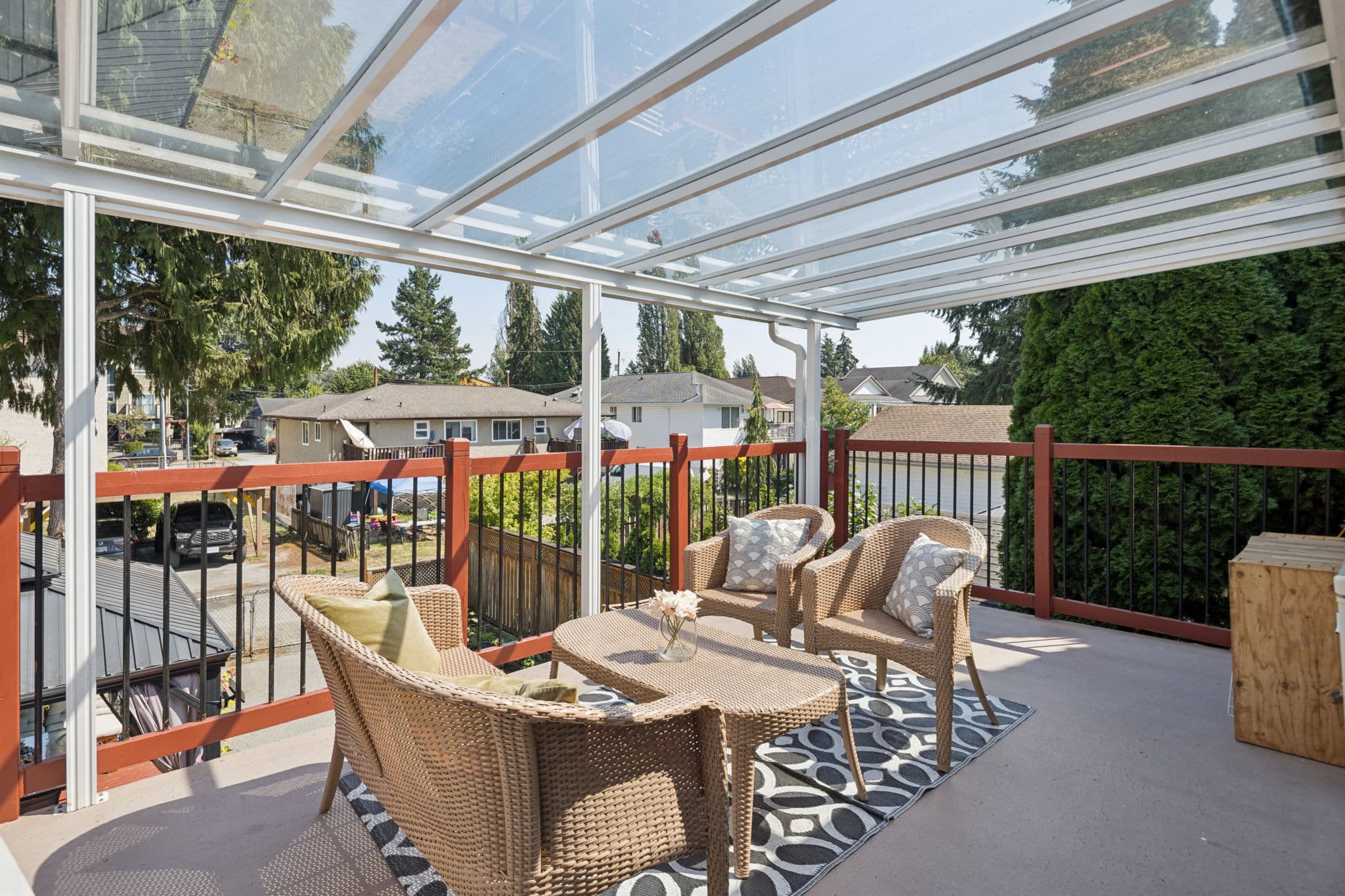 Covered upper deck with seating overlooking the neighbourhood