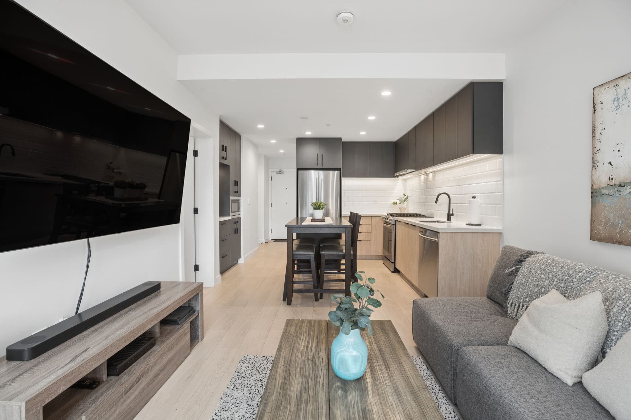 Open-concept living, dining, and kitchen space